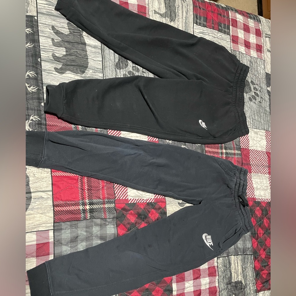 Two pairs of boys medium bike black pants good condition